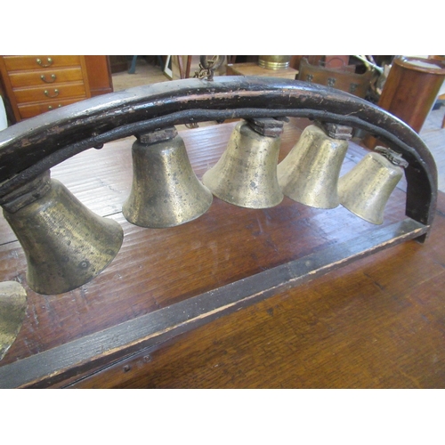 A set of antique hanging bells stamped WR
