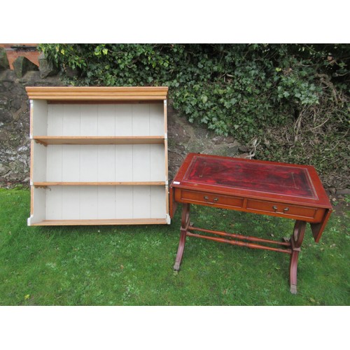 A reproduction writing table with drop down flaps width 36ins depth 20ins
