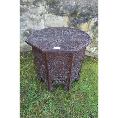 An oak octagonal shaped table , in the liberty style , having extensive ...