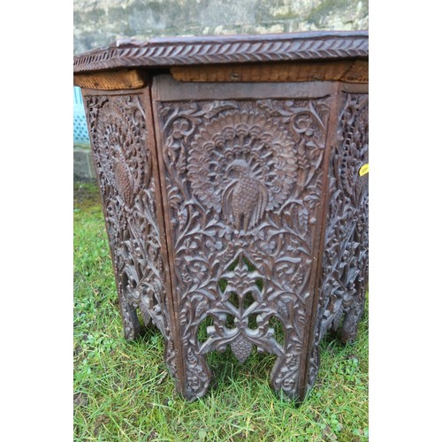 An oak octagonal shaped table , in the liberty style , having extensive ...