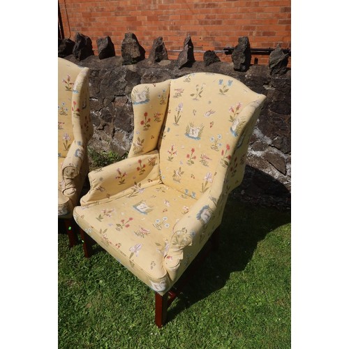 1 - A pair of wing back arm chairs with upholstered decoration with birds TRADE ONLY
