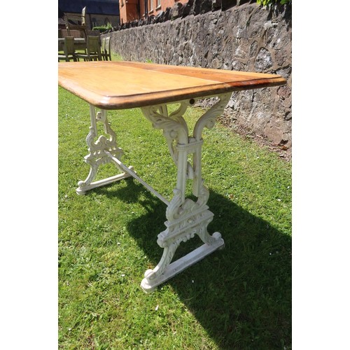 9 - A rectangular topped pub table raised on a plated wrought iron base