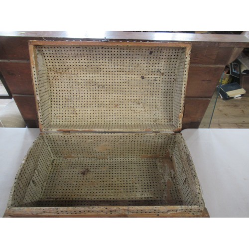 24 - An antique pine dome top trunk, with metal bands and studs, width 24ins, height 13ins
