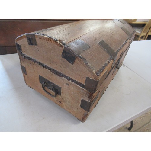 24 - An antique pine dome top trunk, with metal bands and studs, width 24ins, height 13ins