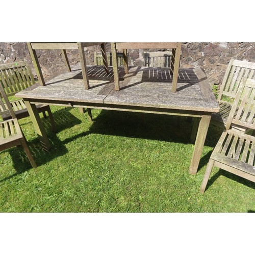 50A - A garden table together with 8 chairs (6+2)