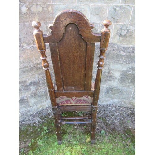 30 - An antique oak hall chair