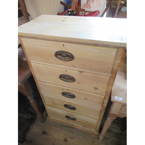 32 - A pine dressing table, chest of drawers and a nest of tables