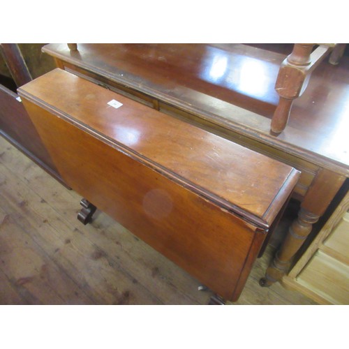 34 - A Sutherland table together with two dressing tables and a commode