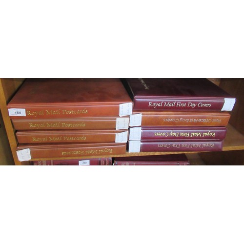 489 - Four albums of First Day Covers, together with four albums of Royal Mail postcards