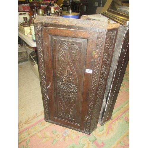 308 - Carved oak corner cupboard