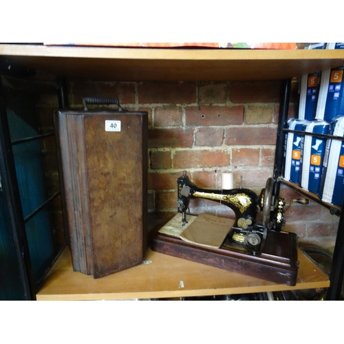 40 - Cased singer sewing machine.
