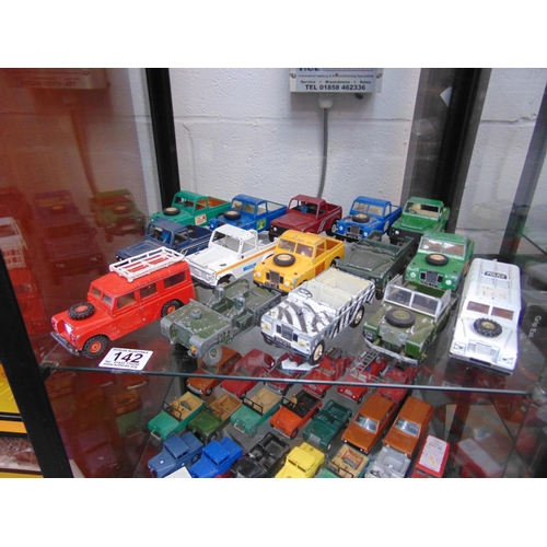 142 - Shelf diecast Landrovers etc