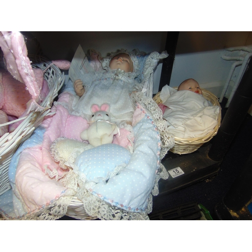 15 - 2 Dolls in wicker baskets