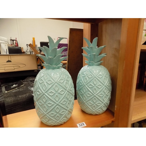 329 - Pair decorative pineapples