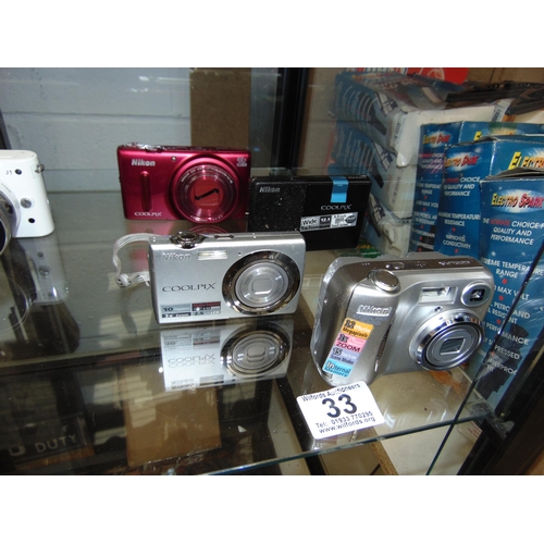 33 - Nikon coolpix cameras etc