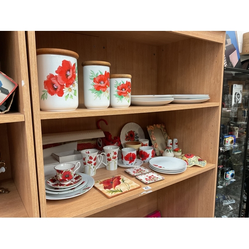 43 - 2 Shelves poppy dinner plates, umbrella etc