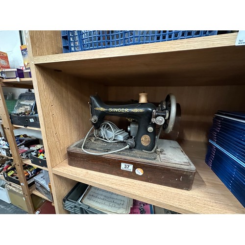 37 - Cased singer sewing machine