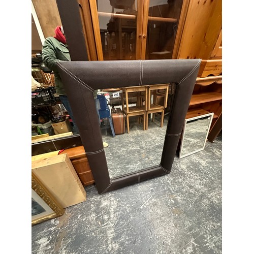 487 - Leather frame mirror..