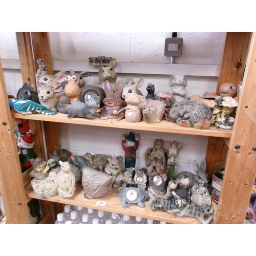 22 - 2 Shelves garden ornaments.