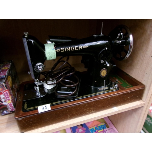 43 - Cased singer sewing machine