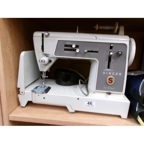 46 - Cased singer sewing machine