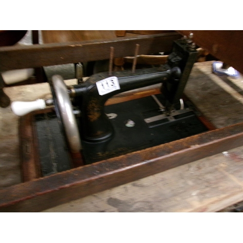 113 - Cased singer sewing machine.