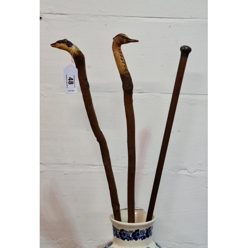 48 - 3 walking sticks, two being carved in the form of a Heron and a Badger