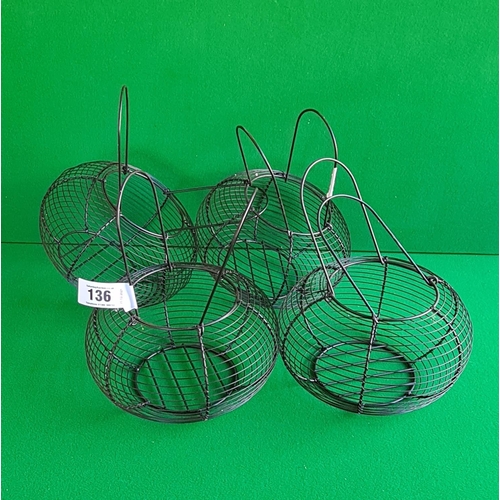 136 - 4 black wire formed egg baskets