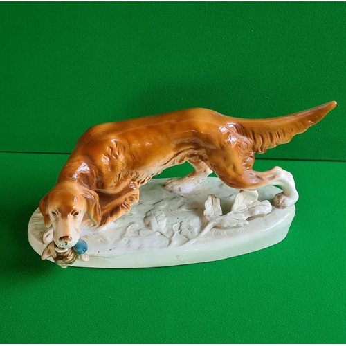 145 - Royal Bohemian china hunting dog 35cm long. Good condition