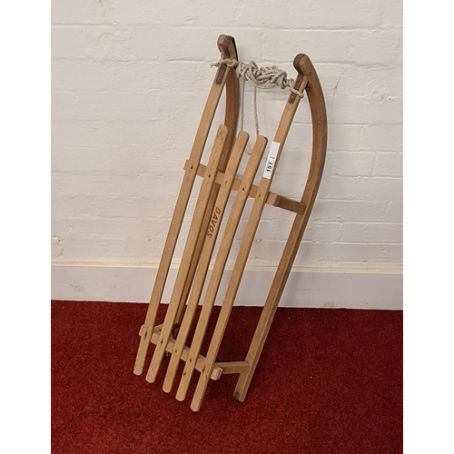 151 - Vintage wooden sledge with metal runners. Circa 1930 and marked 'DAVOS'