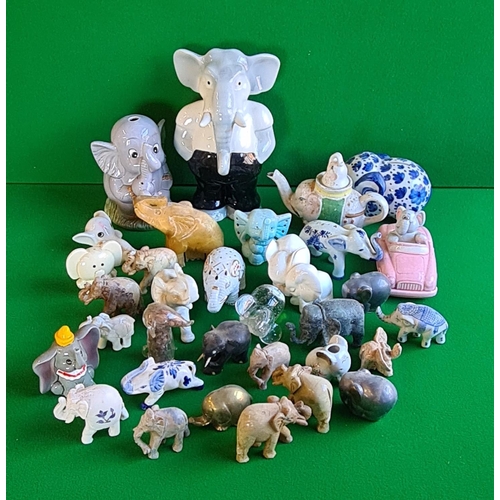 217 - Large selection of over 20 collectable ceramic elephant figures