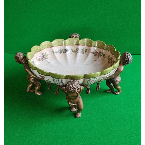 70 - A Wong Lee fluted Continental style bowl footed by 4 cherub figures