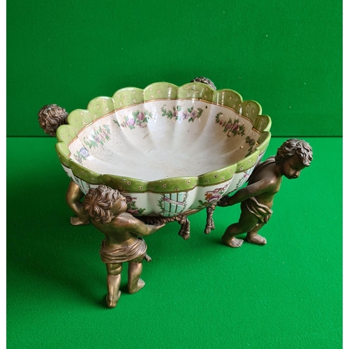 70 - A Wong Lee fluted Continental style bowl footed by 4 cherub figures