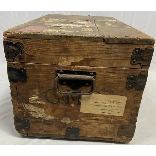 16 - Well travelled wooden trunk having original destination labels