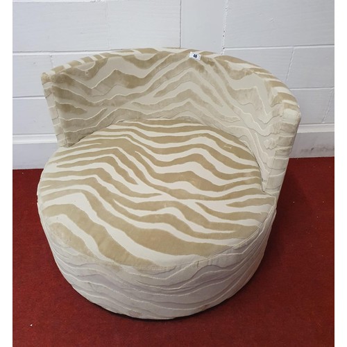 40 - Large round cuddle chair upholstered in embossed animal print fabric 36x100x70 cm