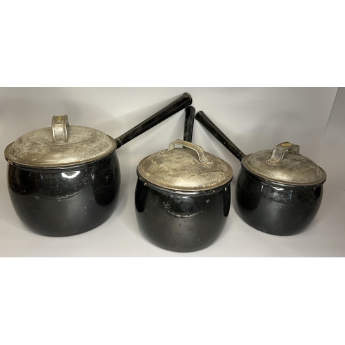 27 - Antique heavy metal cooking vessels and tea pot