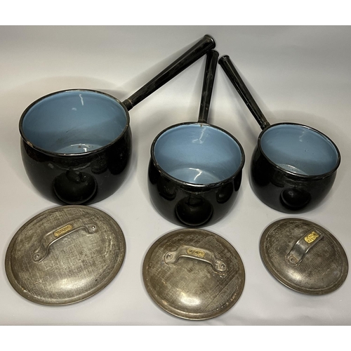 27 - Antique heavy metal cooking vessels and tea pot
