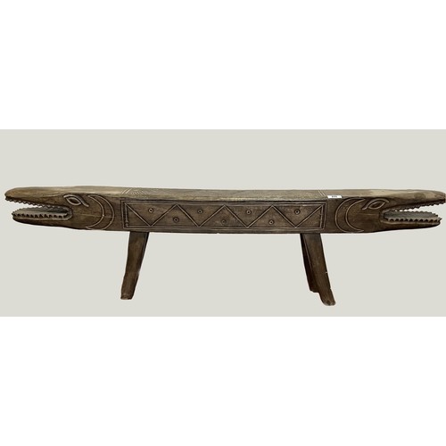 277 - Large and unusual African origin wooden bench in he form of a crocodile measuring 6 foot in length