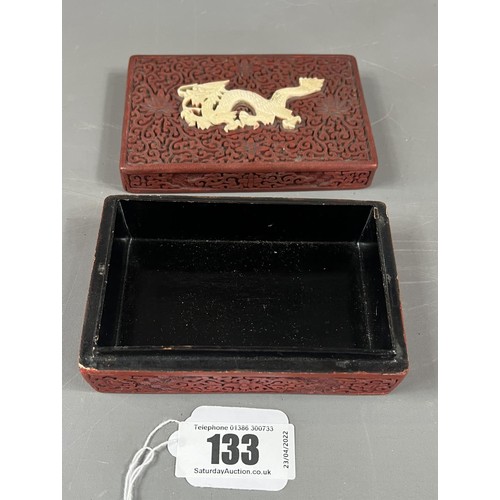 133 - Chinese cinnabar lacquer box with applied dragon to lid