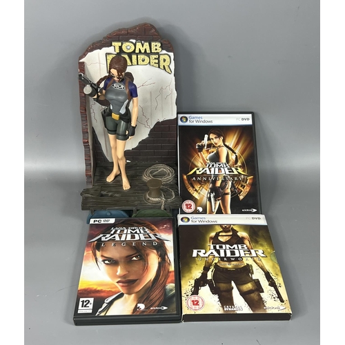 59 - Tomb Raider doll figure with 3 computer games. Shipping Group (A).