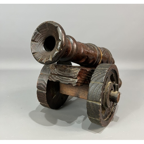 31 - Large wooden carved cannon 30x50cm. Shipping Group (A).