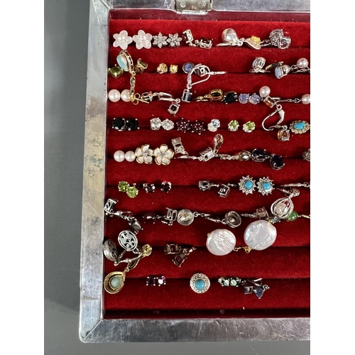 197 - Large amount of earrings, majority stamped .925 and contained in a pretty white metal display case h... 