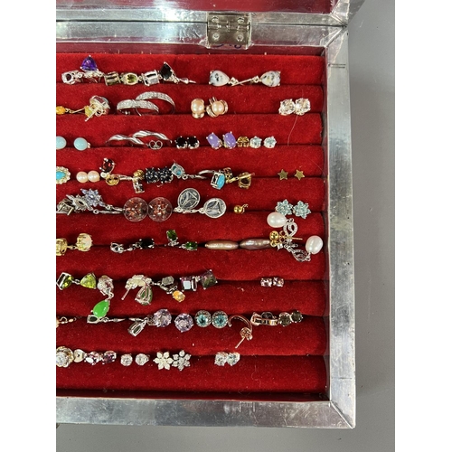 197 - Large amount of earrings, majority stamped .925 and contained in a pretty white metal display case h... 