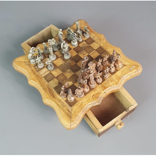 198 - Unusual chess set and board, raised on squat supports and having two opposing drawers. 20x20cm. Ship... 