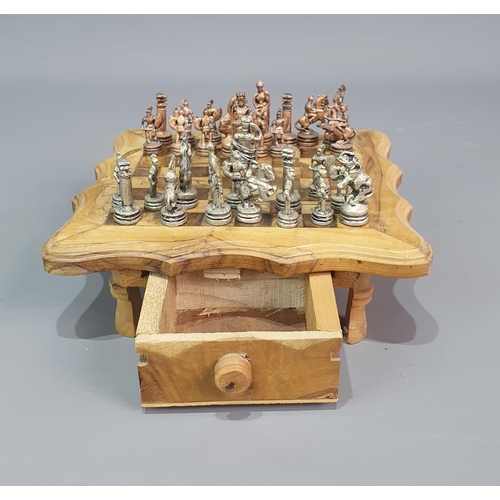 198 - Unusual chess set and board, raised on squat supports and having two opposing drawers. 20x20cm. Ship... 