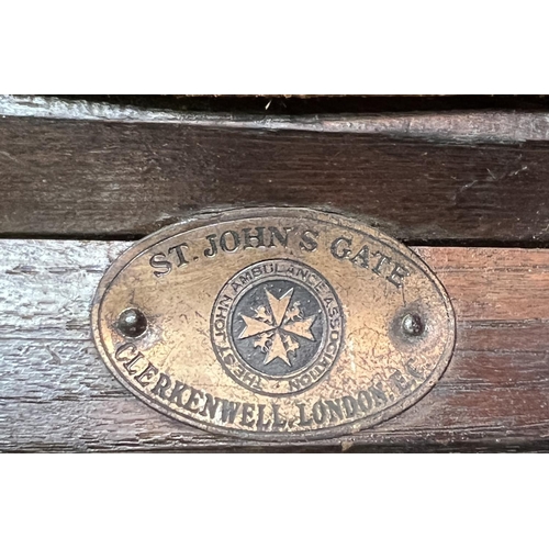 200 - Full size antique St. Johns Ambulance stretcher. Constructed of solid oak and canvass having pull-ou... 