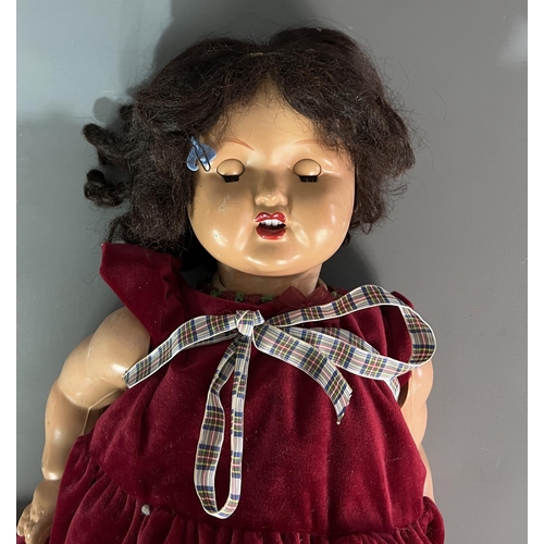 287 - Porcelain doll measuring 70cm in height. Shipping Group (A).