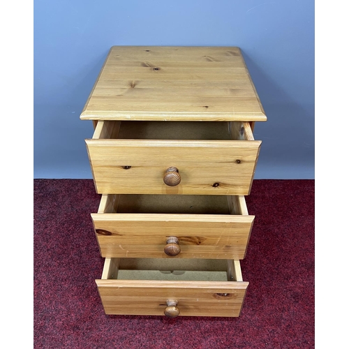 384 - Pine 3 drawer bedside unit. 58x42x42cm. Collection only or please arrange your own courier.