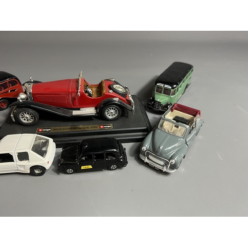 10 - A selection of die cast toy model vehicles including Burago Mercedes SSK, Morris Minor, London black... 