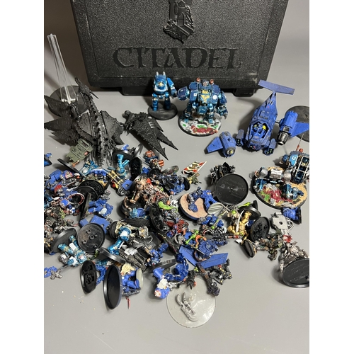 77 - Warhammer carry case with a good quantity of spare/repair figures. Shipping Group (A).